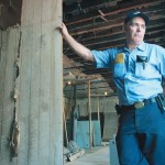 Richard Lyons stands in Clara Barton's Missing Soldiers Office during the renovation